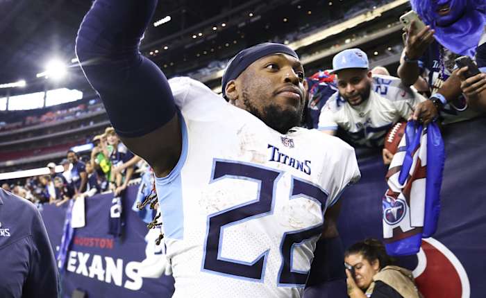Fans cheer as Tennessee Titans running back Derrick Henry (22) runs off the field after the game against the Houston Texans at NRG Stadium.